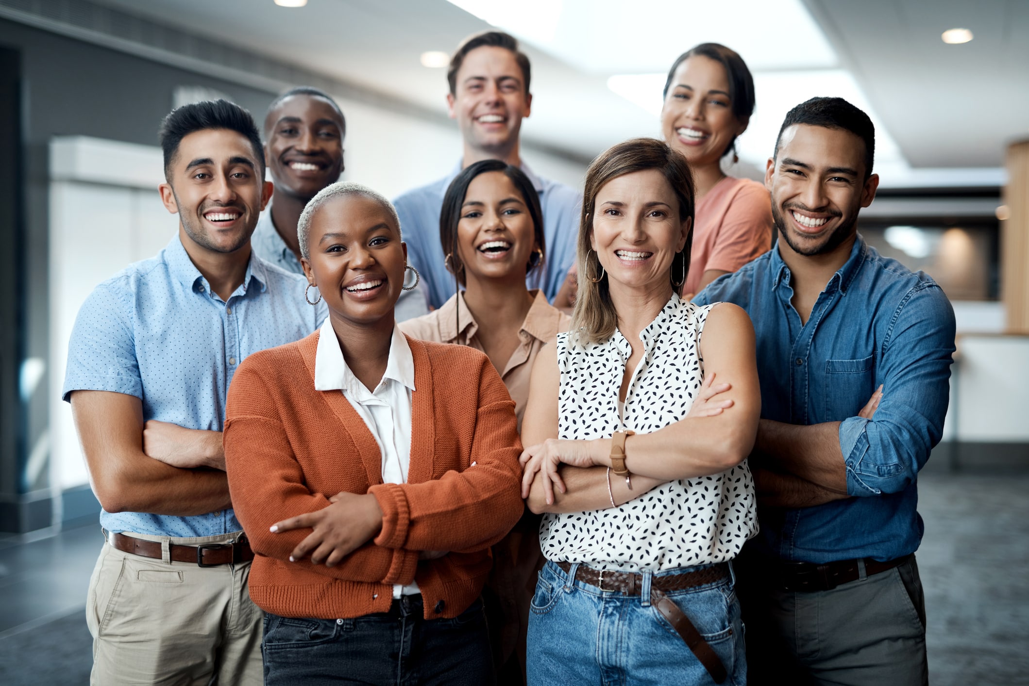 group of happy travel nusre agency coworkers stand side by side